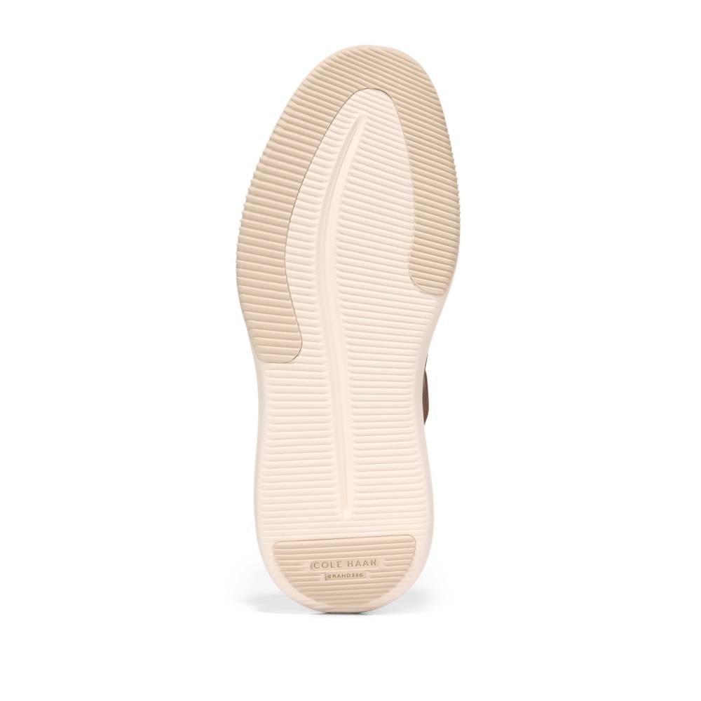 A tan shoe sole with concentric ripples at toe and heel.