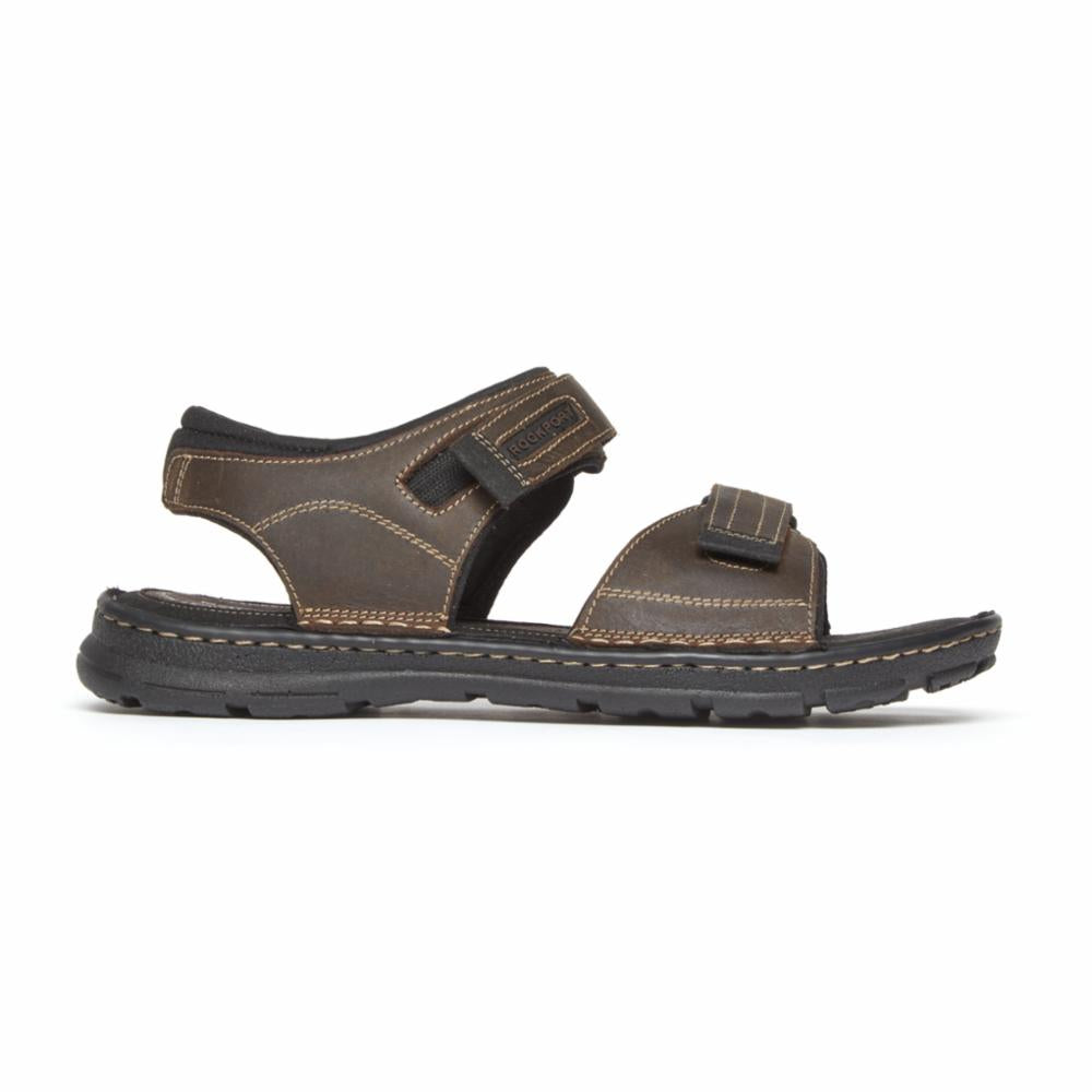 Brown men's sandal with black sole and velcro straps.