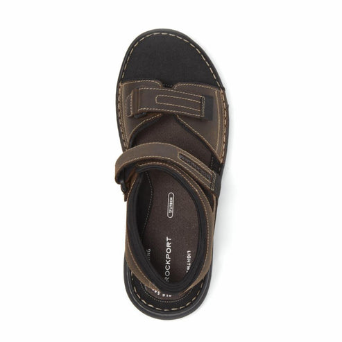 Overhead view of brown sandal with two hook-and-loop fasteners.