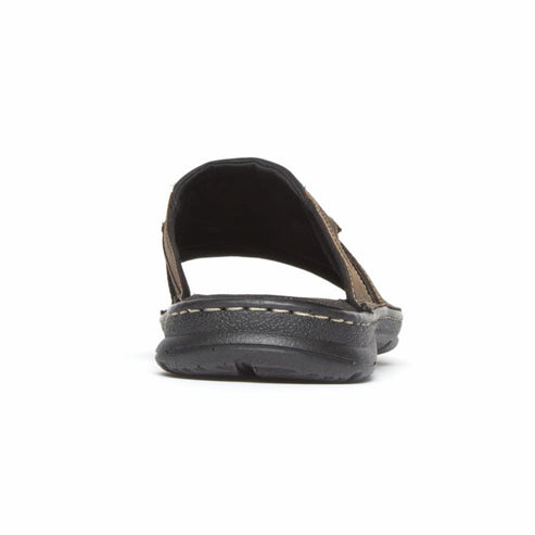 Rear view of a brown slide sandal with dark sole.