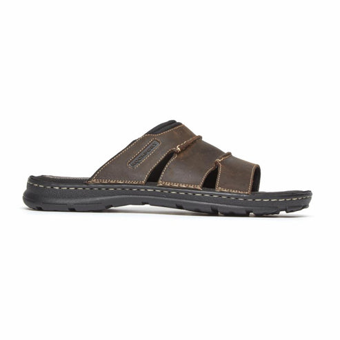 Side view of a dark brown leather sandal with black sole.