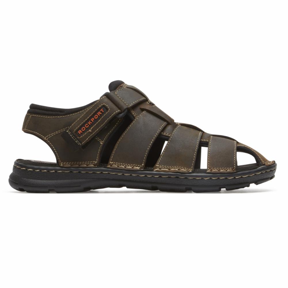 Brown leather sandal with multiple straps and hook-and-loop closure. "ROCKPORT" is printed in red on the strap.
