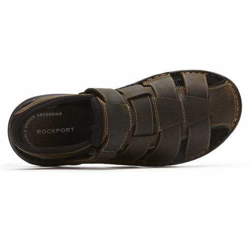 Top view of a dark brown leather sandal with velcro straps and woven details.