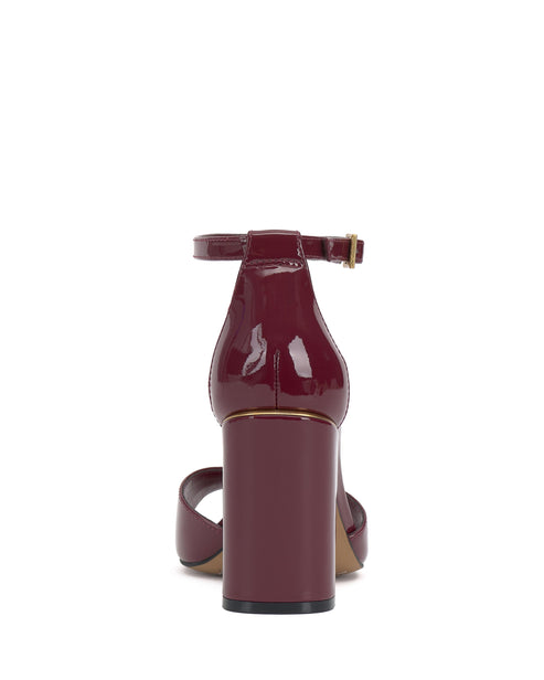 Burgundy patent leather block heel sandal with ankle strap.