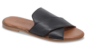Black leather slide sandal with tan sole and criss-cross upper.
