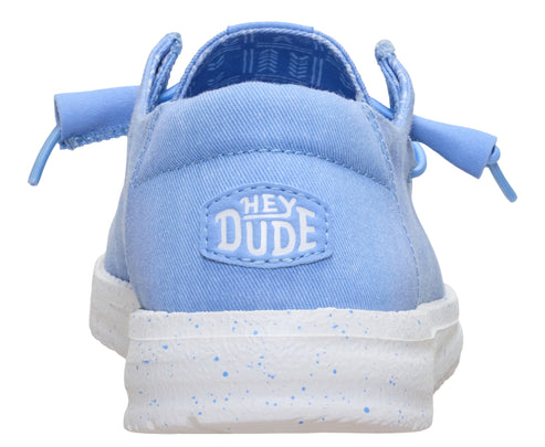 Light blue shoe with white speckled sole, featuring "HEY DUDE" logo on the heel.
