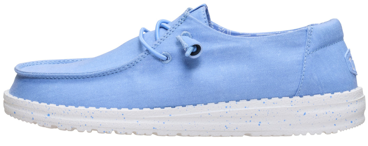 A low-profile, light blue shoe with white soles and laces.