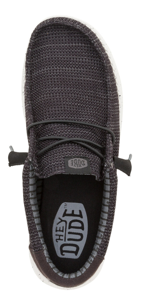 Overhead view of a grey slip-on sneaker with laces.