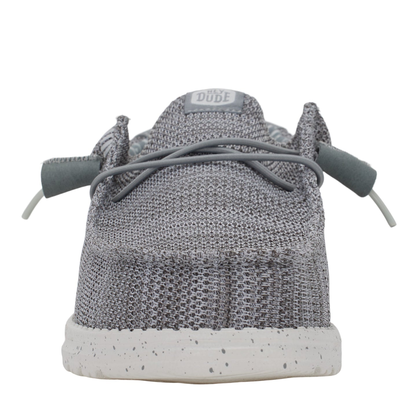 Back of a gray knit shoe with white speckled sole and tied gray laces.