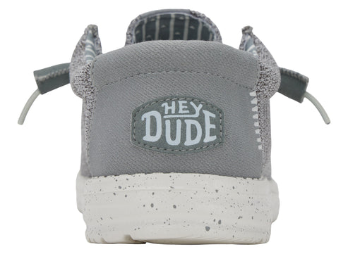Back view of gray slip-on shoe with "HEY DUDE" emblem and white speckled sole.
