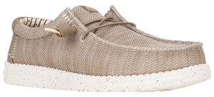 A low-profile tan slip-on shoe with a white speckled sole and decorative laces.