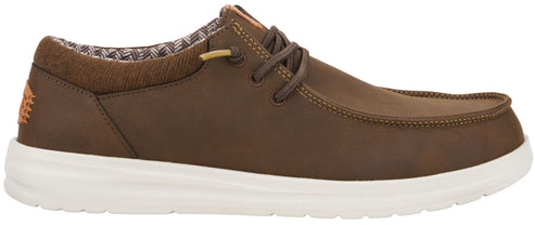 A brown slip-on casual shoe with a rounded toe, thick white rubber sole, and a decorative herringbone patterned collar lining.