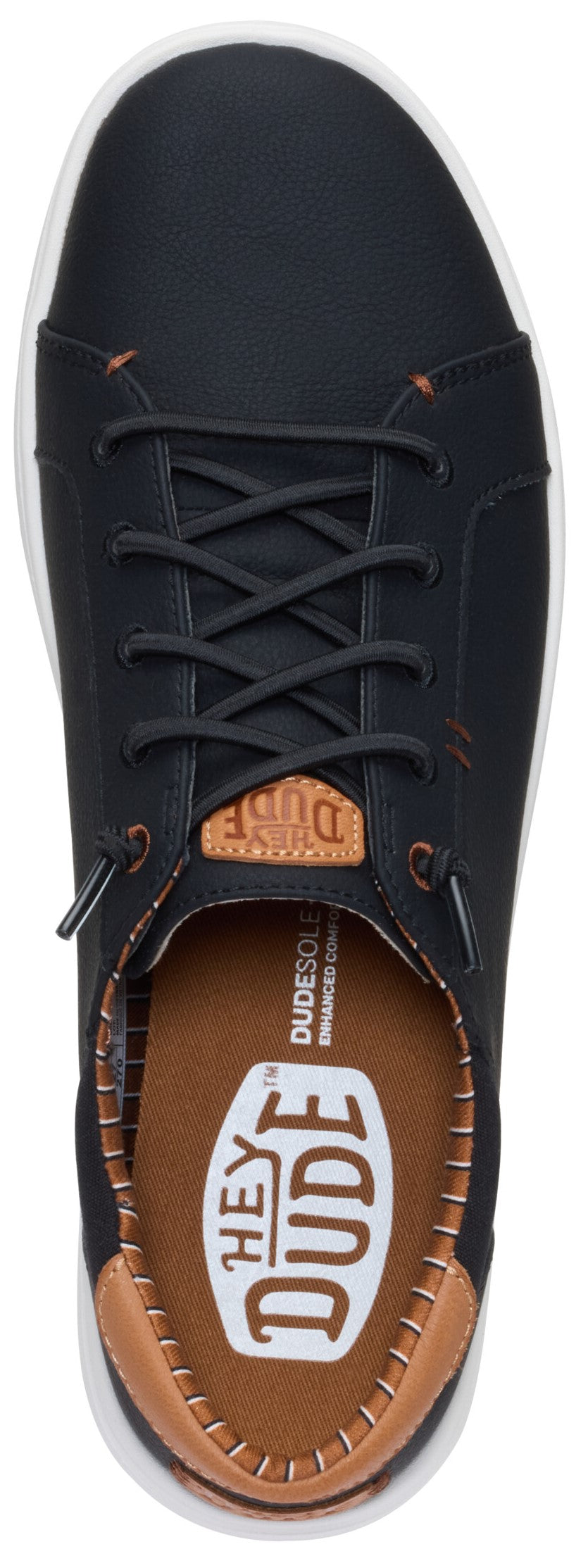 A slip-on sneaker in dark leather with laces and white soles.