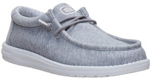 Slip-on sneaker, gray fabric upper, white sole, laces.