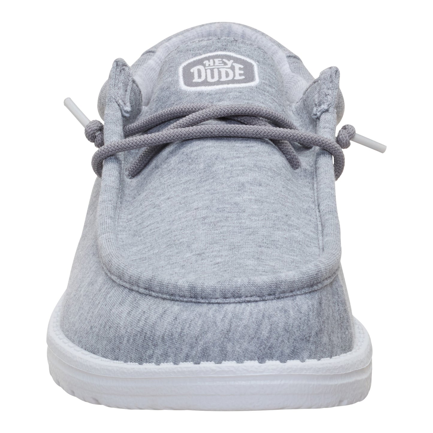 Grey slip-on shoe with white sole and grey laces; logo at the tongue.