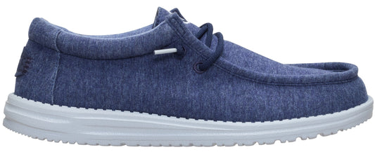 A slip-on blue shoe with white sole.