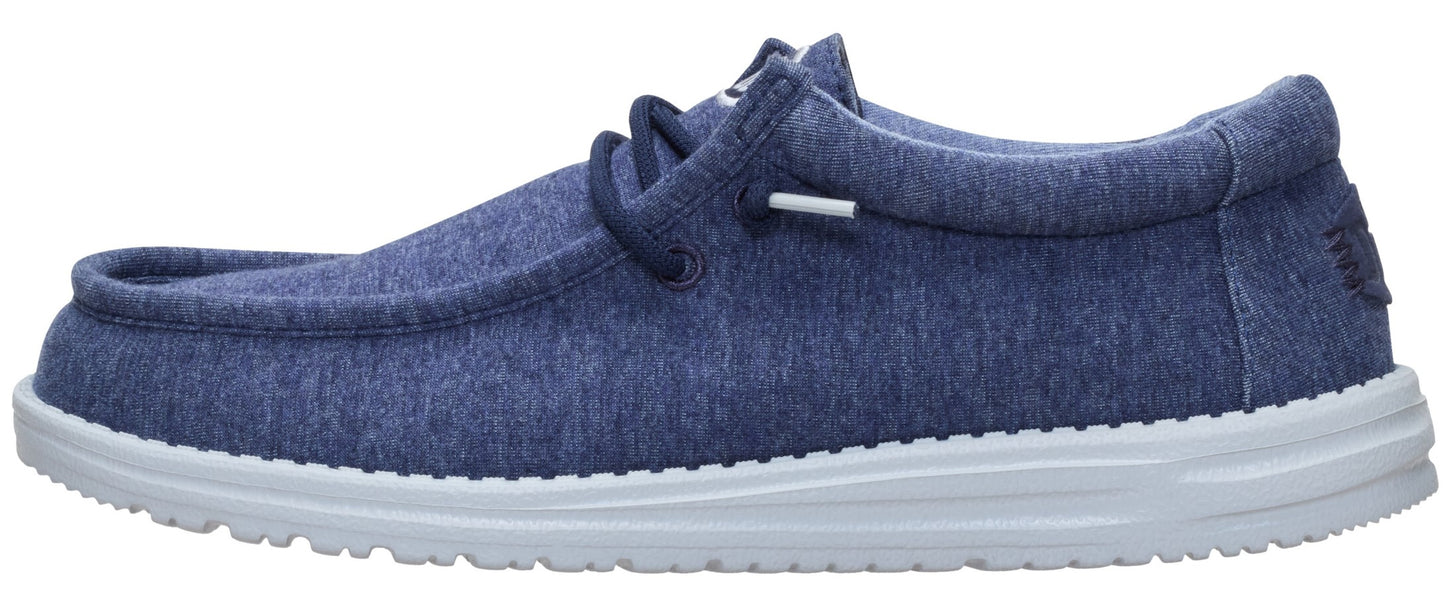 Blue textile slip-on shoe with white sole and laces.