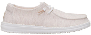 A casual, low-profile shoe with a light-colored, textured upper and white laces.