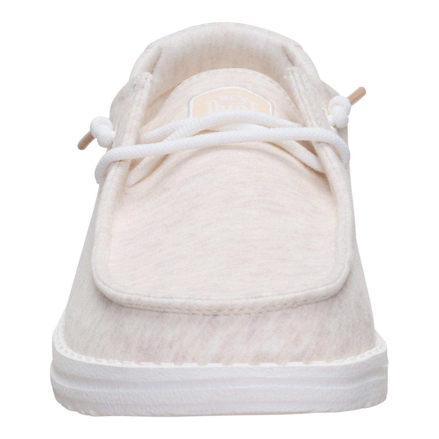 Front view of a slip-on shoe with white laces and a textured white upper, contrasted by a white sole.