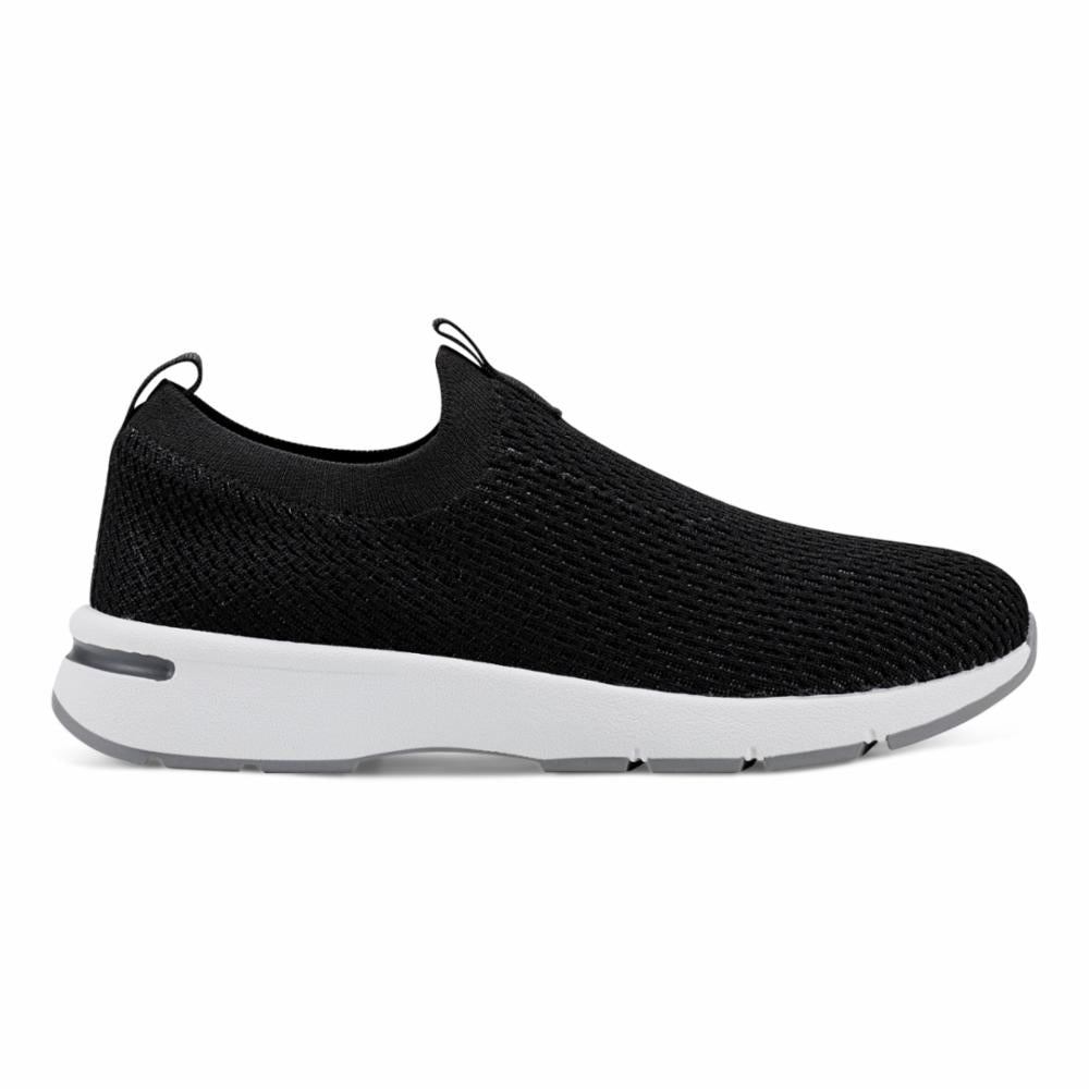 Black slip-on sneaker with white sole.