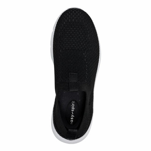 Top-down view of a black slip-on sneaker with a knit upper and a white sole.