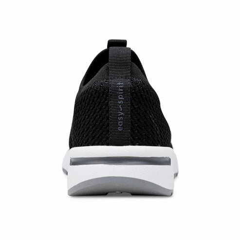 Back of black slip-on shoe with white sole and "easy spirit" printed on the heel.