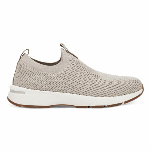 Slip-on knit sneaker with white rubber sole and brown tread.