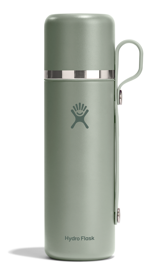 Green, cylindrical water bottle with handle and silver accent.