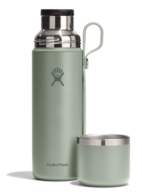 Green Hydro Flask insulated bottle with handle and separate insulated cup.