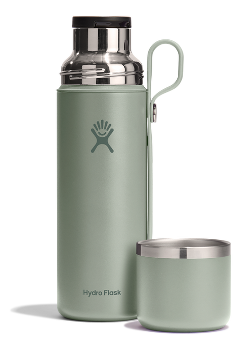 Light green water bottle with silver lid and handle, and a matching cup.