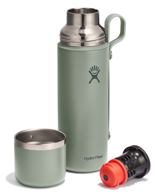 Sage colored stainless steel bottle with a gray handle, with the stainless steel cup and black filter placed next to it.