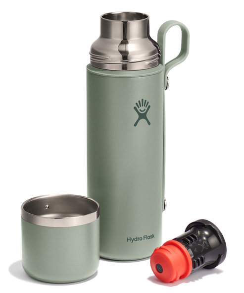 Sage colored stainless steel bottle with a gray handle, with the stainless steel cup and black filter placed next to it.