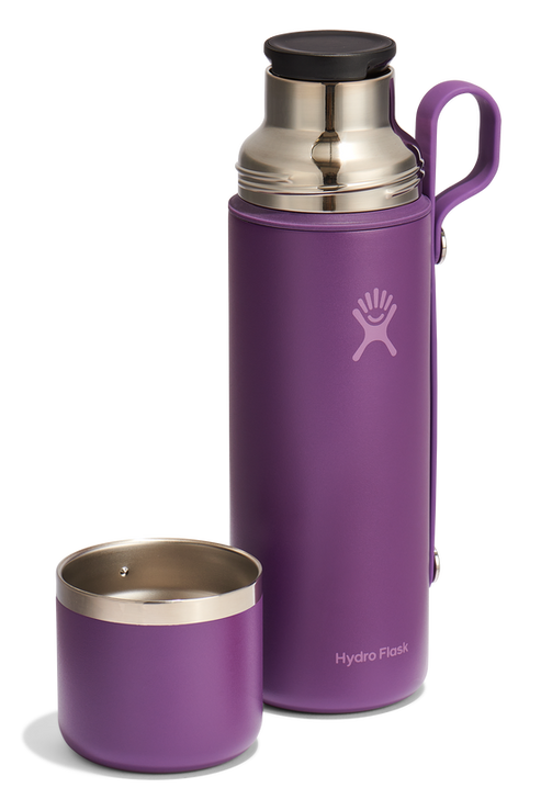 Purple water bottle with a removable cup.