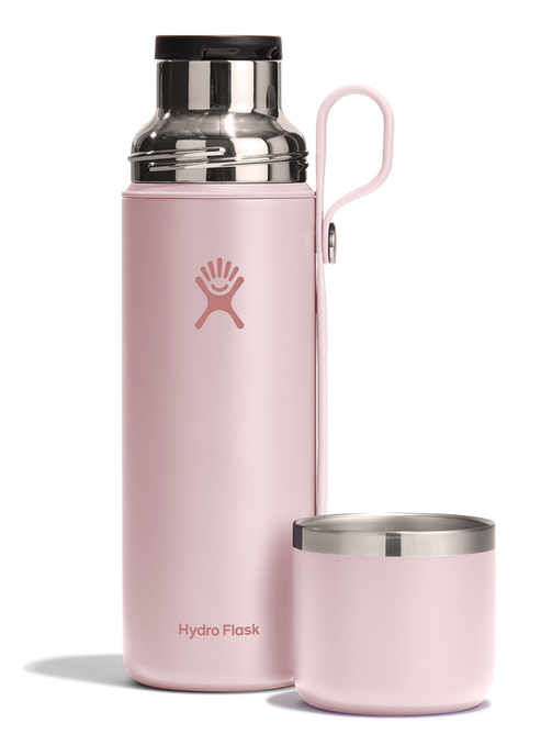 Pink water bottle with handle and removable pink lid.