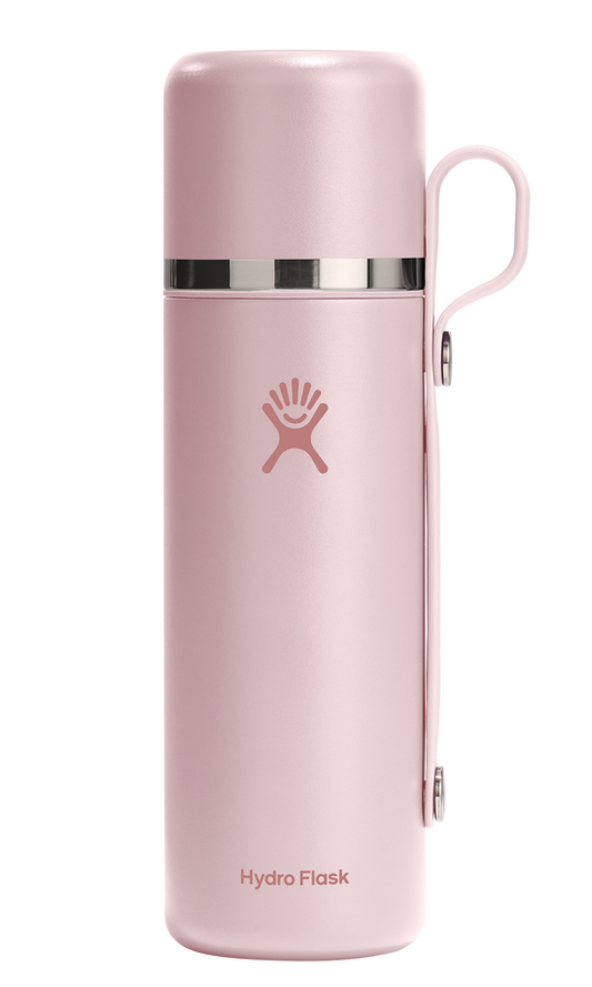 Pink water bottle with handle and logo.