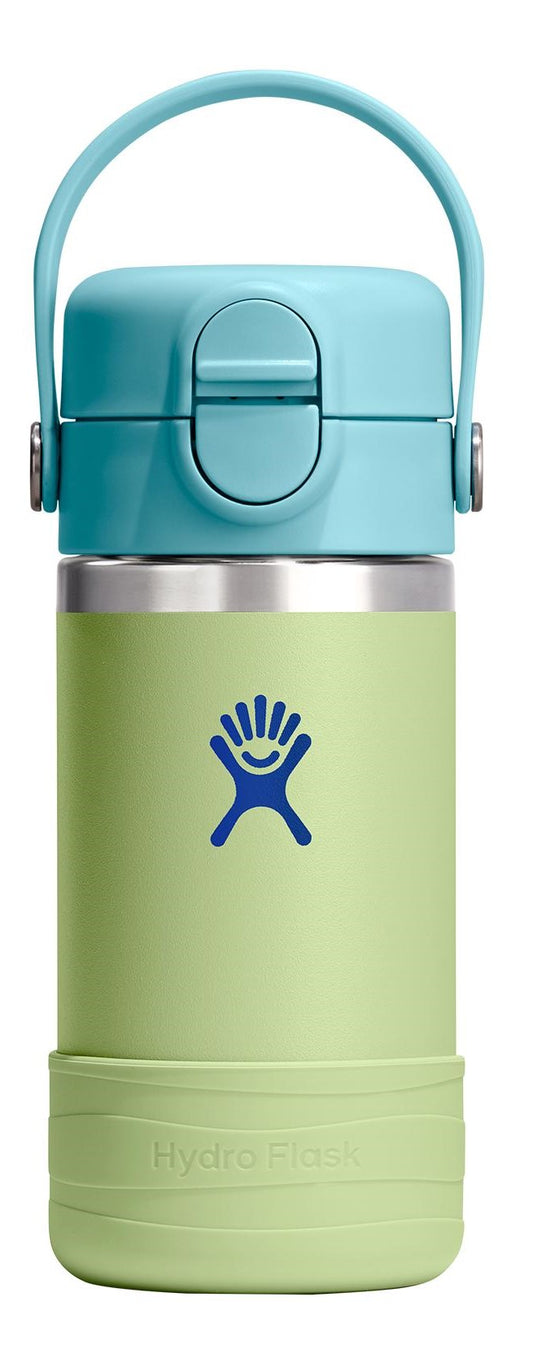 A Hydro Flask water bottle with a blue lid, handle, and logo against a light green body and base.