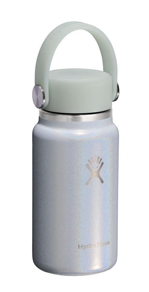 Short, light blue iridescent water bottle with a light green lid and handle, bearing a light-colored stylized logo on the side.