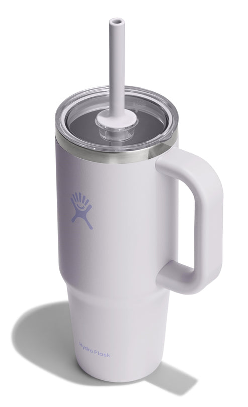 White mug with handle and straw.