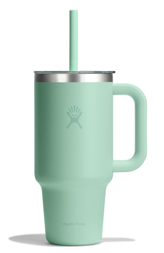 Insulated light green mug with handle, metal lid, and straw.