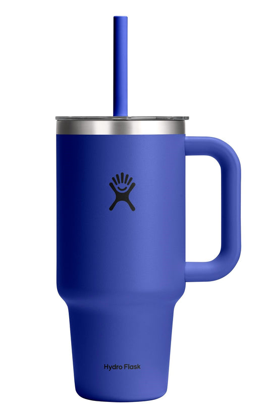 Blue metal cup with handle, straw, and visible text 'Hydro Flask'.
