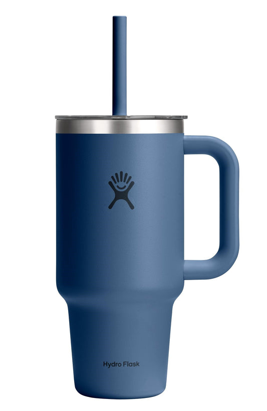 Blue insulated mug with a handle, silver lid, and straw with a smiley face logo.