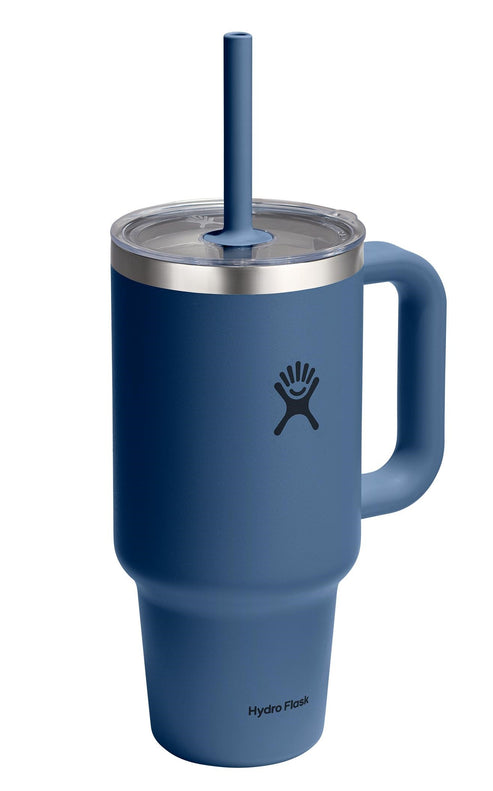 Blue tumbler with a handle, a transparent lid, and a blue straw.