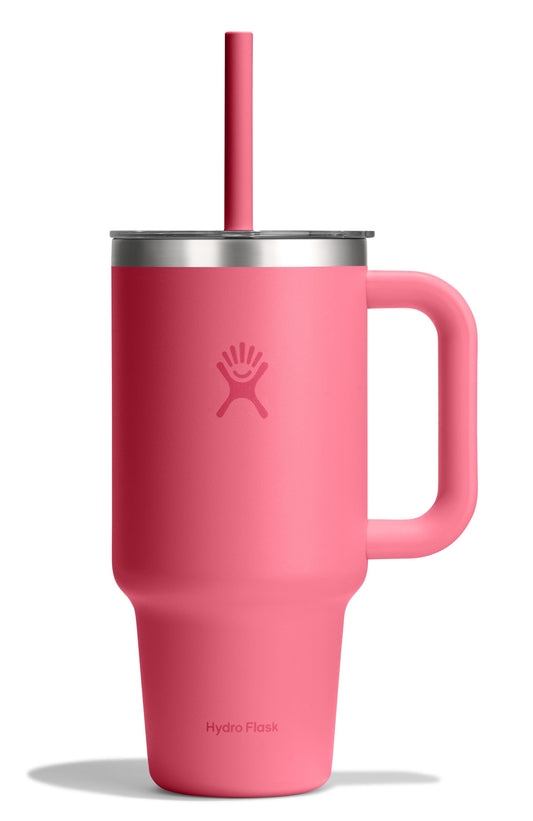 Pink metal insulated mug with a handle, a lid, and a straw.
