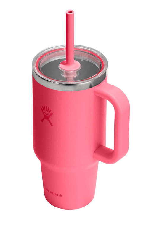 A pink stainless steel tumbler with a handle and straw.