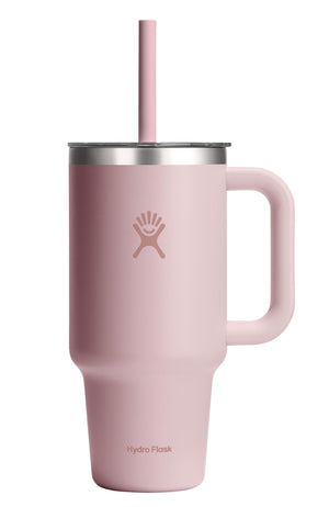 Light pink insulated tumbler with handle and straw.
