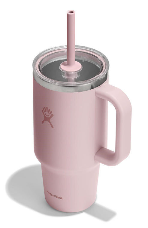 Pink mug with handle, lid, and straw.
