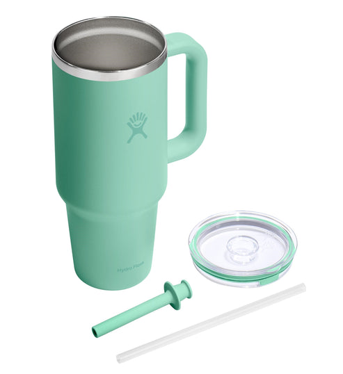 Mint green tumbler with handle, lid, and straw.