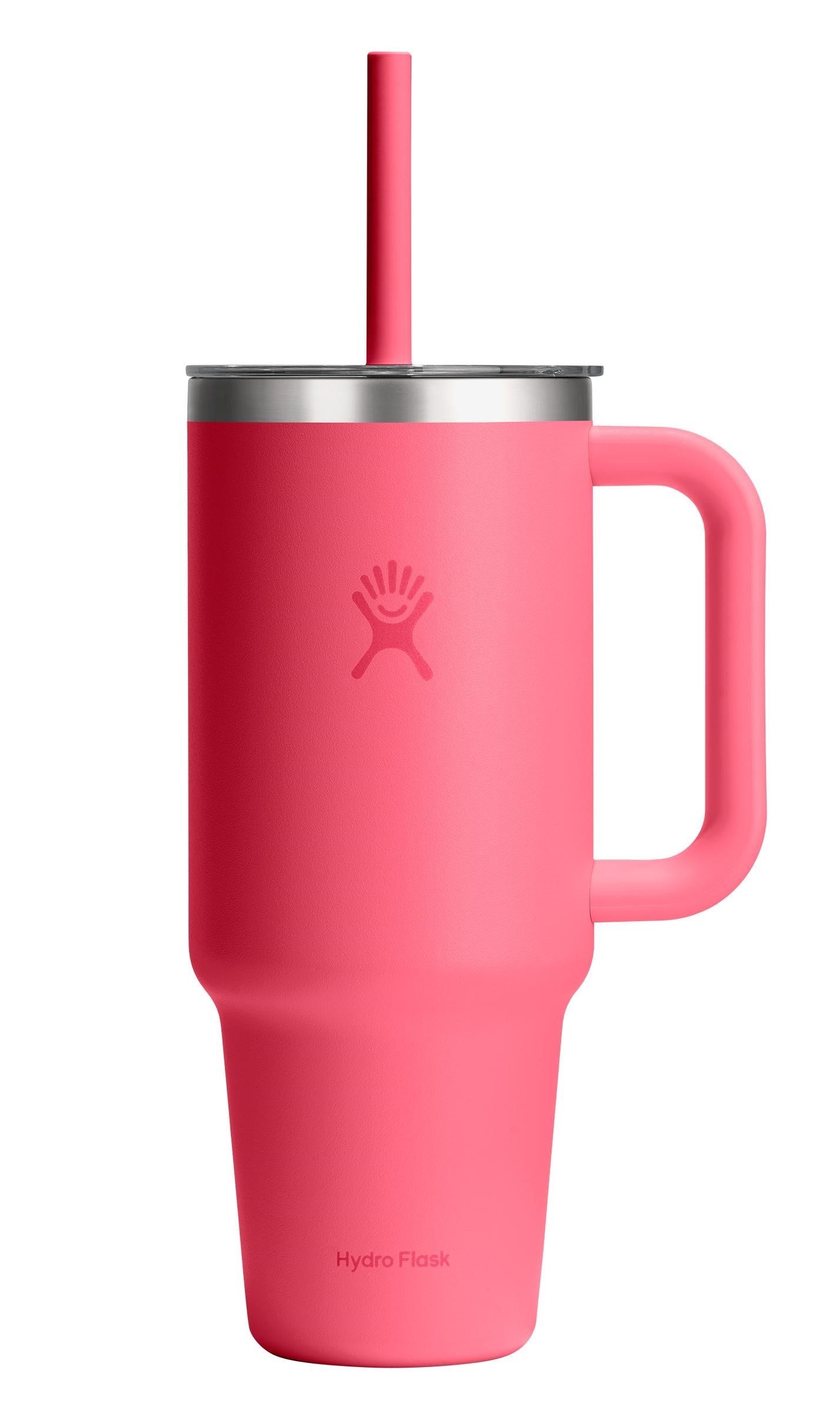 Pink insulated mug with handle and straw.