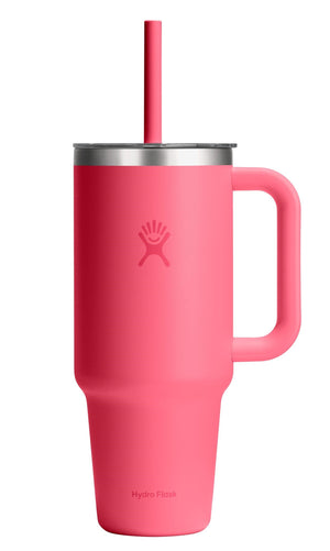 Pink insulated mug with handle and straw.