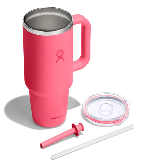 Pink stainless steel mug with handle, lid, and straw.